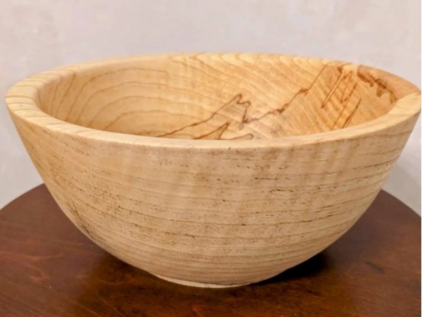 Hand made solid wood food safe Ash bowl with natural details.