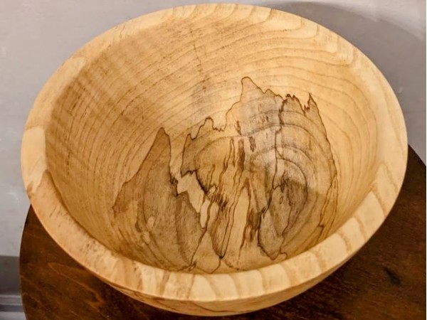 Hand made solid wood food safe Ash bowl with natural details.