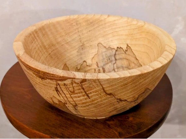 Hand made solid wood food safe Ash bowl with natural details. Hand made solid wood food safe Ash bowl with natural details.